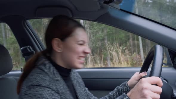 Young Woman Sitting Inside Car Is Very Upset and Stressed