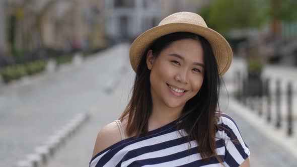 Portrait of Beautiful Asian Girl Smiling Brightly