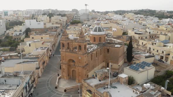 Aerial Counterclockwise Shot of Marsaxlokk Parish Church in Malta