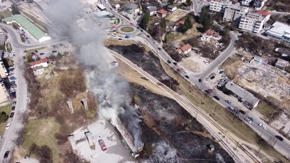 Aerial View Of Firemen Calming The Fire In A Building 4K