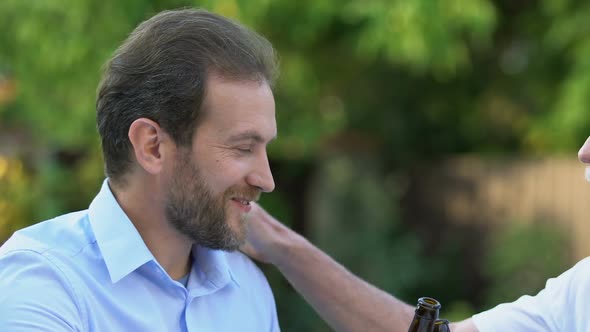 Senior Father and Adult Son Drinking Beer, Sharing News, Trustful Relations