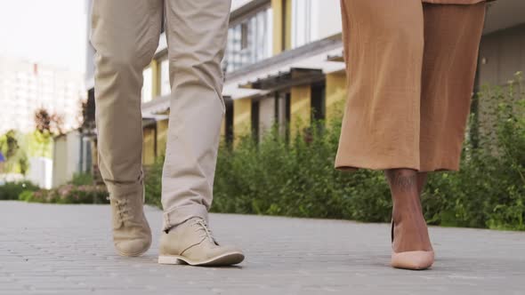  Legs of Man and Woman Walking Outdoors