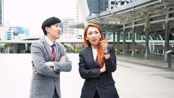 Young Asian Business Man Discussing with Business Woman