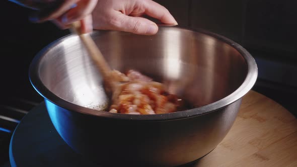 Person Stirring In A Bowl With Chicken Meat - Cooking Chicken Noodles