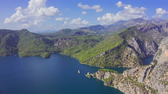 Aerial View on a Lake Among Mountain Cliffs in the Area of the Oymapinar Dam. Landscape of Green