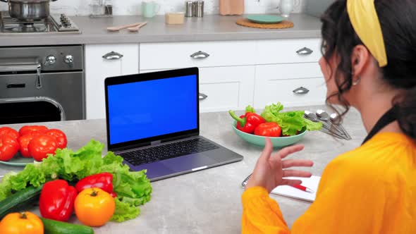 Blue Screen Laptop Woman Greets Watch Online Cooking Course Tells Chef Teacher