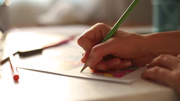 Hands of the artist draw a color storyboard on paper. Storytelling. 