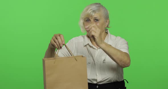 An Elderly Woman with Shopping Bag. Shopping. Presents. Chroma Key