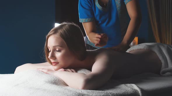 Young, Beautiful Woman in Spa Salon Lying on the Coach Waiting for Massage
