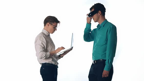 Two Business People Using Laptop in Meetingdolly Shot