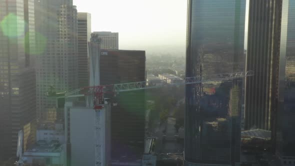 AERIAL: Flying Towards Construction Site Skyscraper in Downtown Los Angeles, California Skyline at