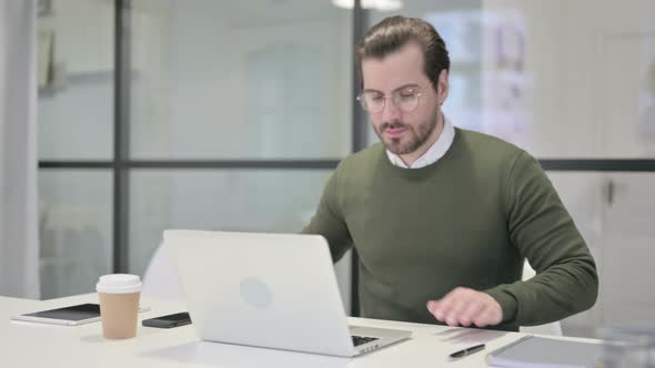 Young Businessman Closing Laptop Standing Up Going Away