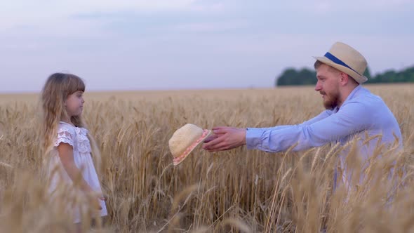 Family Countryside Weekend, Young Handsome Dad and His Little Girl Plays While He Shows Tricks with