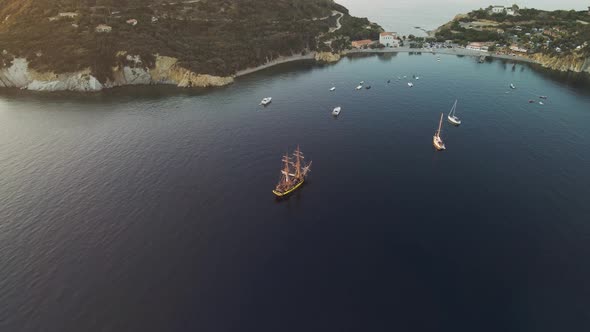 Aerial view of a pirate vessel along the coast, Elba Island, Tuscany, Italy.