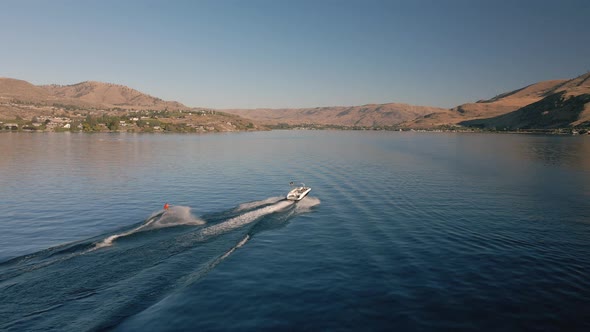 Watersports Aerial Video Of Summer Fun Wakeboarding Behind Boat On Lake Chelan