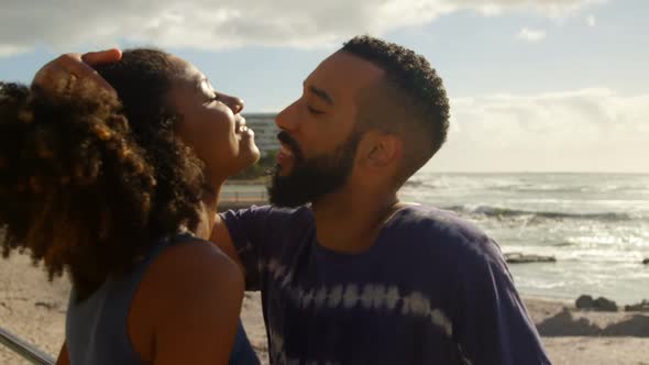 Couple kissing each other at beach 4k