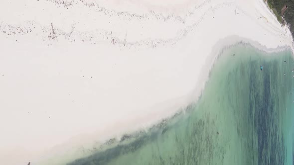 Vertical Video of the Ocean Near the Coast of Zanzibar Tanzania Aerial View