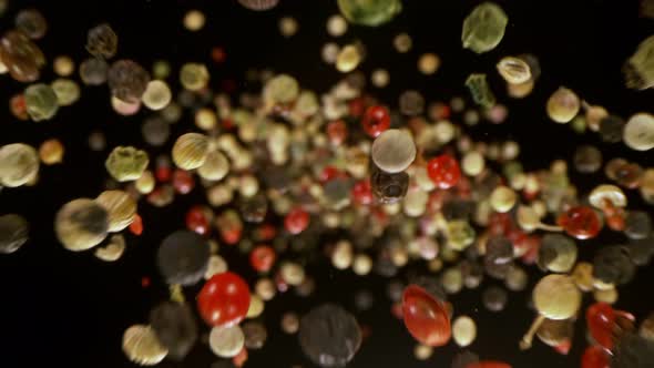 Super Slow Motion Detail Shot of Color Pepper Flying Towards Camera at 1000Fps
