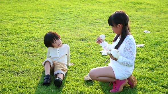 Cute Asian Children Holding Mushroom In The Park