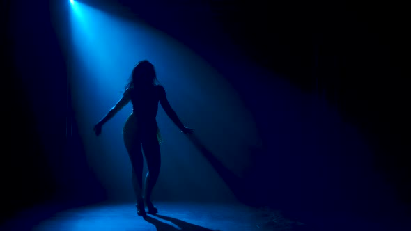 Man Dancing Latin Music. Bachata, Merengue, Salsa. Shot in a Dark Studio with Neon Lights in the