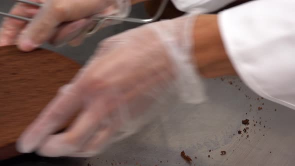 A Dark Cake Base Is Horizontally Sawed Into Several Levels - Closeup