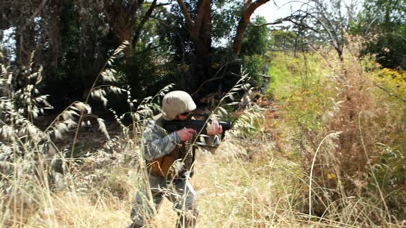 Military soldier guarding with a rifle