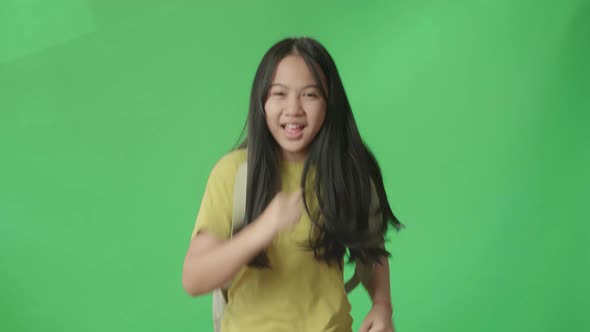 Asian Girl Student Running To School On Green Screen Chroma Key