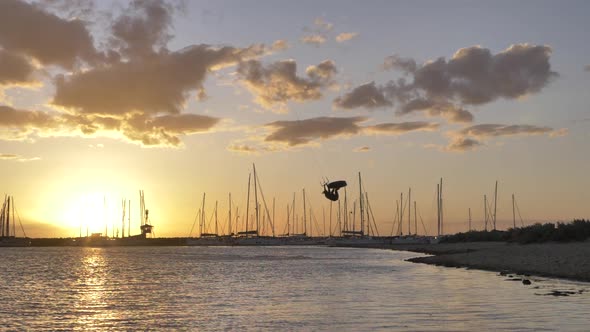 Kitesurfing at sunset in slow motion