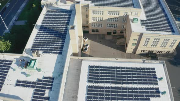 Aerial Drone Shot Orbiting a Large PV Solar Installation on Bayside High School