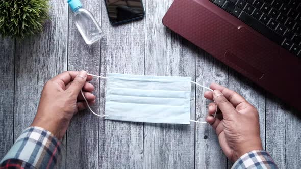 Top View of Blue Surgical Masks on Office Table