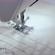 Close-up of a Sewing Machine Needle Moving Rapidly Up and Down. In a Sewing Workshop, a Tailor Sews - VideoHive Item for Sale