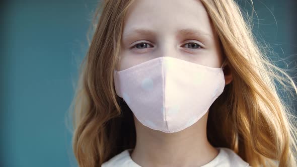 Close Up of Face of Female Child in Medical Pink Mask, Protection From Corona Virus, Back To School