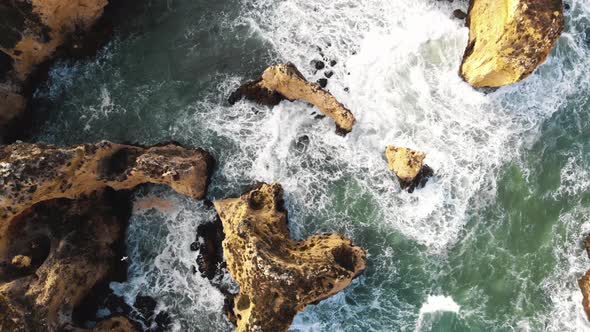 Bird's eye view of Algarve rocky cliffs and rugged coastline, Ponta da Piedade, Lagos Portugal 