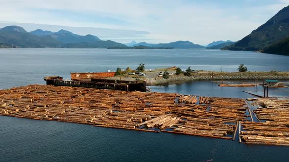 Log booms with mountains in background