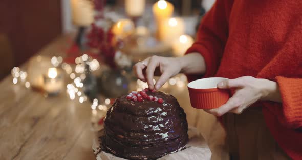 Female Decorating a Chocolate Pie Closeup