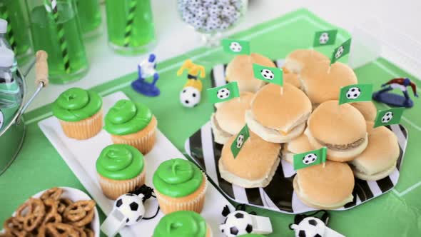 Kids football party set with snacks and drinks.