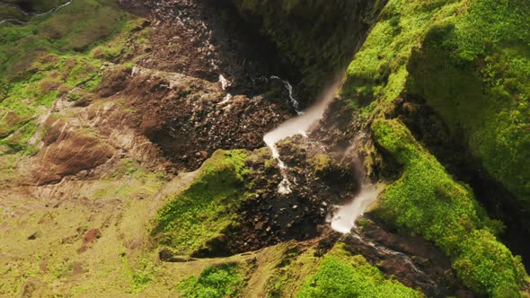 Waterfall Flowing Down Mountain of Poco Ribeira Do Ferreiro Flores Island