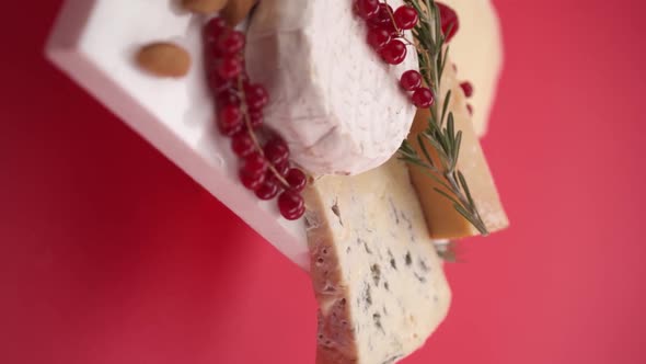 Vertical video: Parmesan, blue cheese and camembert