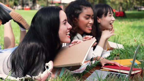 Group of Three Diversity University Student Friends Smiling and Laughing at Educational Campus