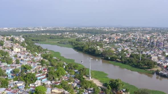 Cable car over Ozama river at Santo Domingo, Dominican Republic. Aerial forward