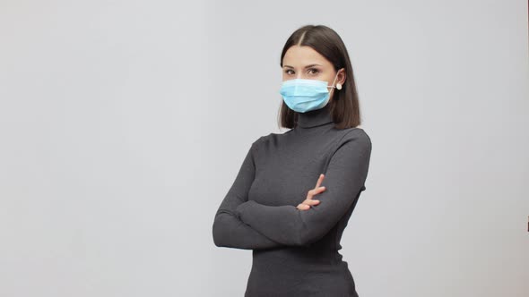 Serious Caucasian Woman In Grey Turtle Neck Bodycon Dress Wears Face Mask, Pandemic Concept