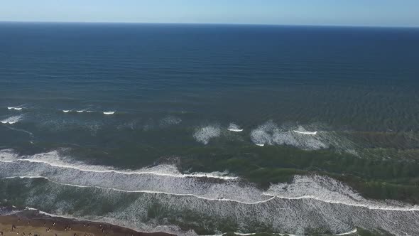 Aerial scene with drone from the beach. The camera moves forward along the beach. Buenos Aires, Arge