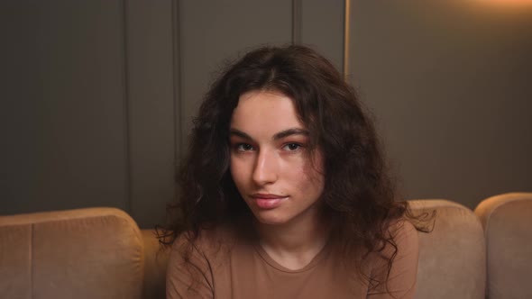 Confident Smiling Young Woman Looking at Camera Standing at Home Office