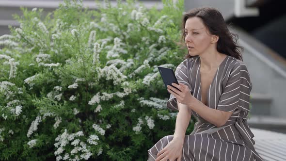 Woman is Recording Voice Message By Smartphone Sending in Social Networks