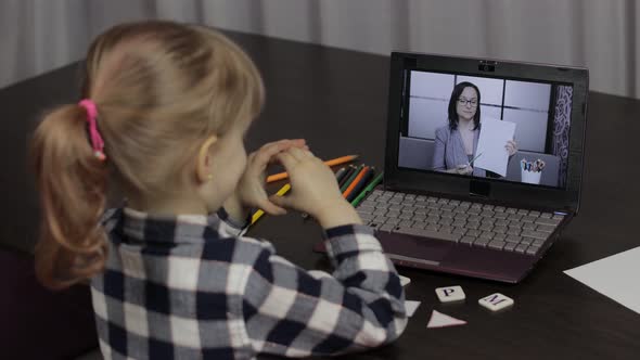 Children Distance Education on Laptop. Online Lesson at Home with Woman Teacher