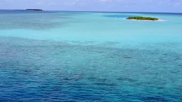 Drone texture of shore beach break by clear ocean and sand background