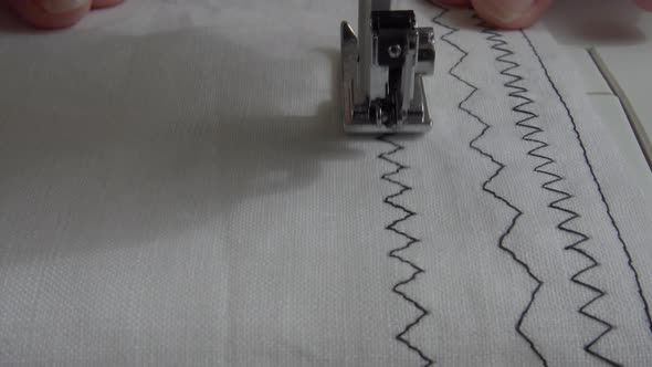 Sewing machine with fabric and thread, closeup.