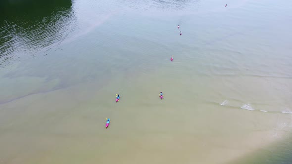 Aerial view of people kayaking in Ao Thalane to enjoy the beauty of limestone mountains and fertile