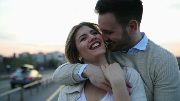 Romantic Couple in Love Hugging Kissing Outdoor in Sunset