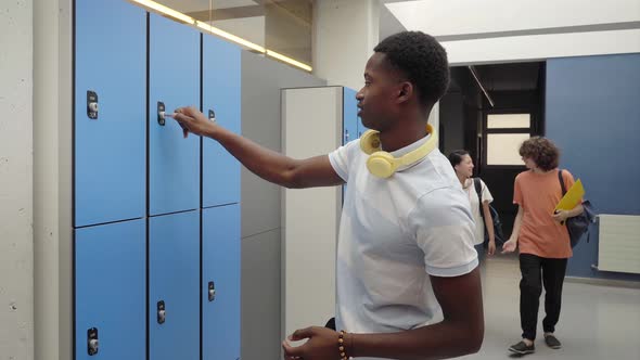 African American Student Opening His High School Locker